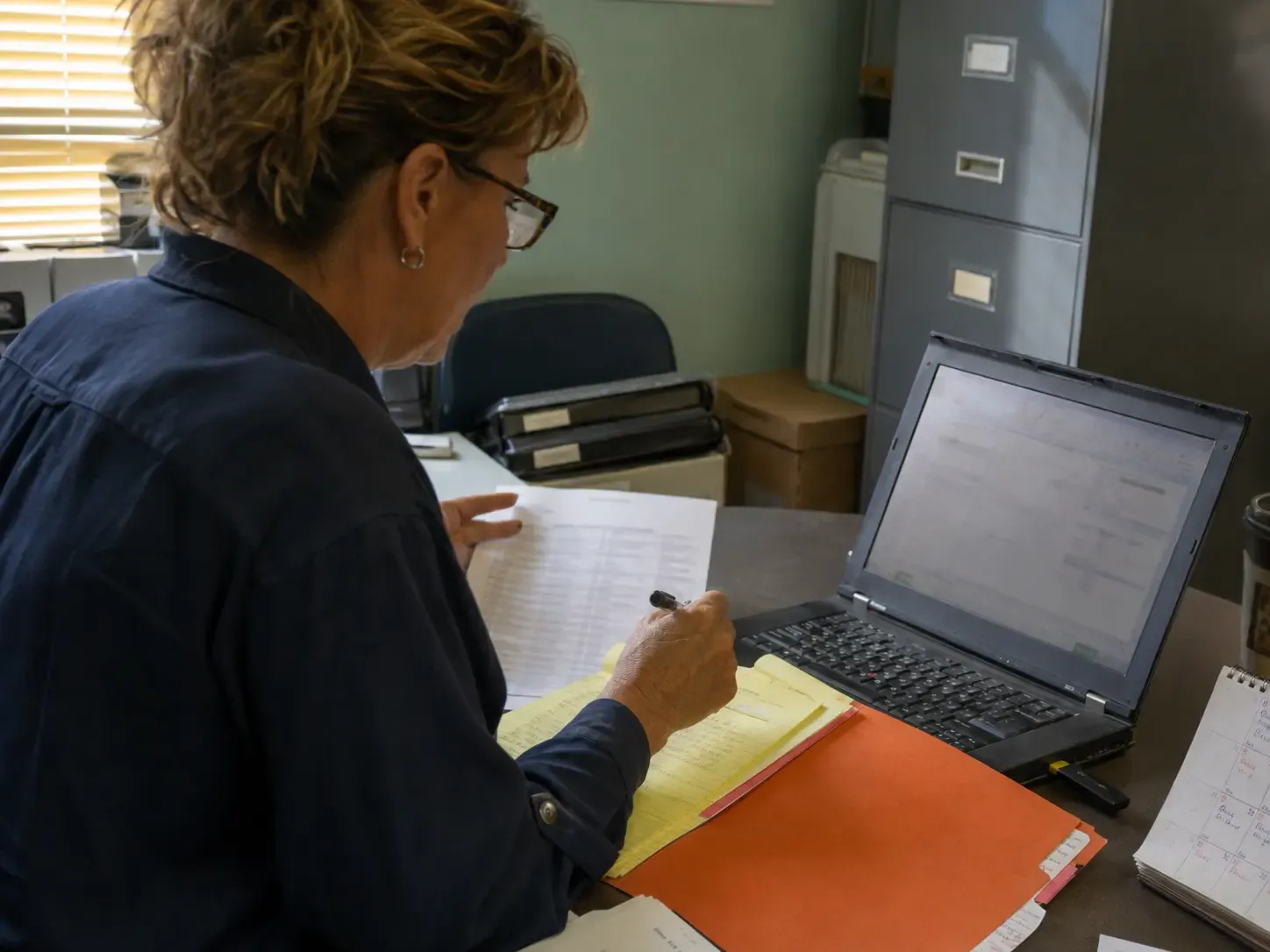 A community sales director reconciling inquiry notes with an existing CRM